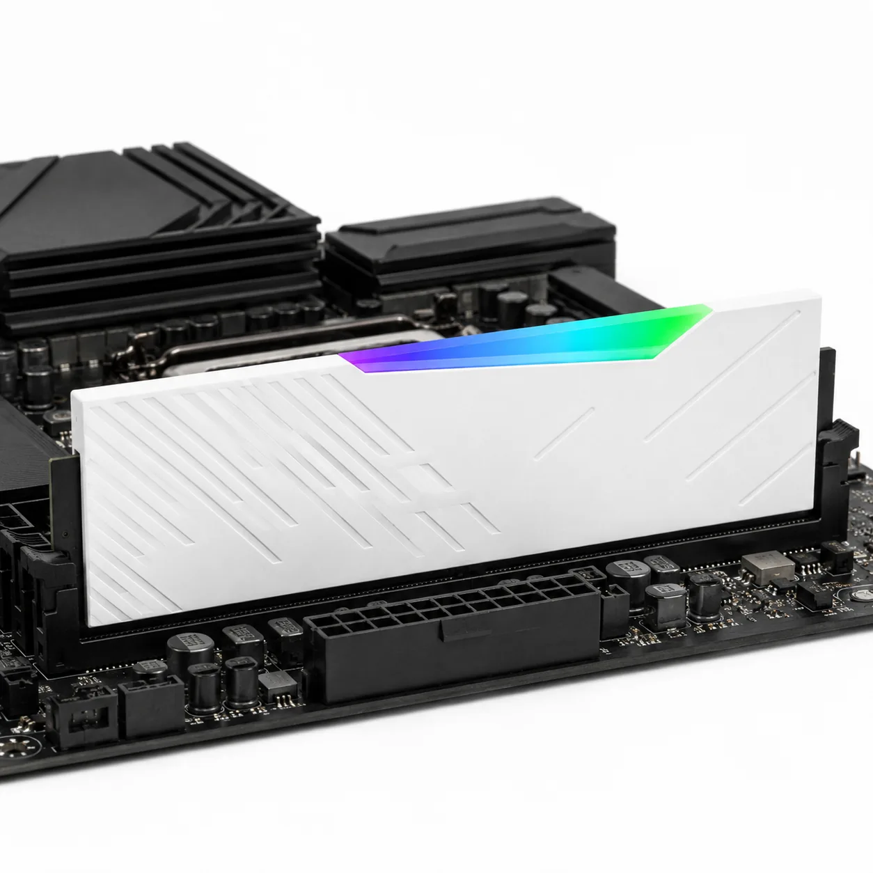 White DDR5-6000 module installed upright in a DIMM slot on a motherboard